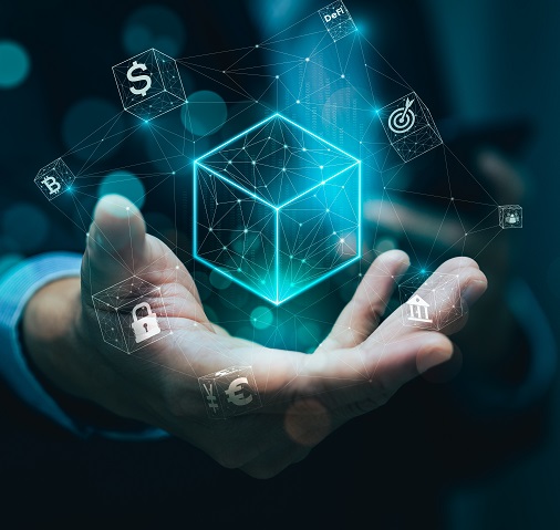 A person holds a glowing 3D cube surrounded by digital icons representing finance and security concepts.